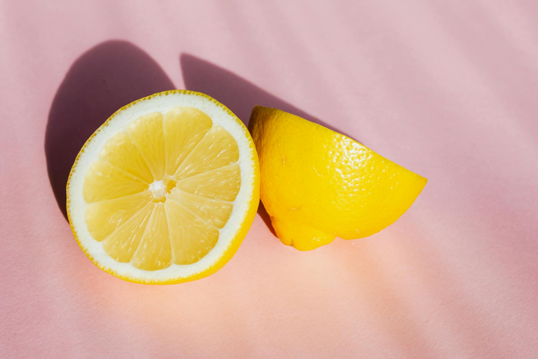 Vibrant collection of colorful lemon clitoral vibrators and adult toys on a bright yellow surface