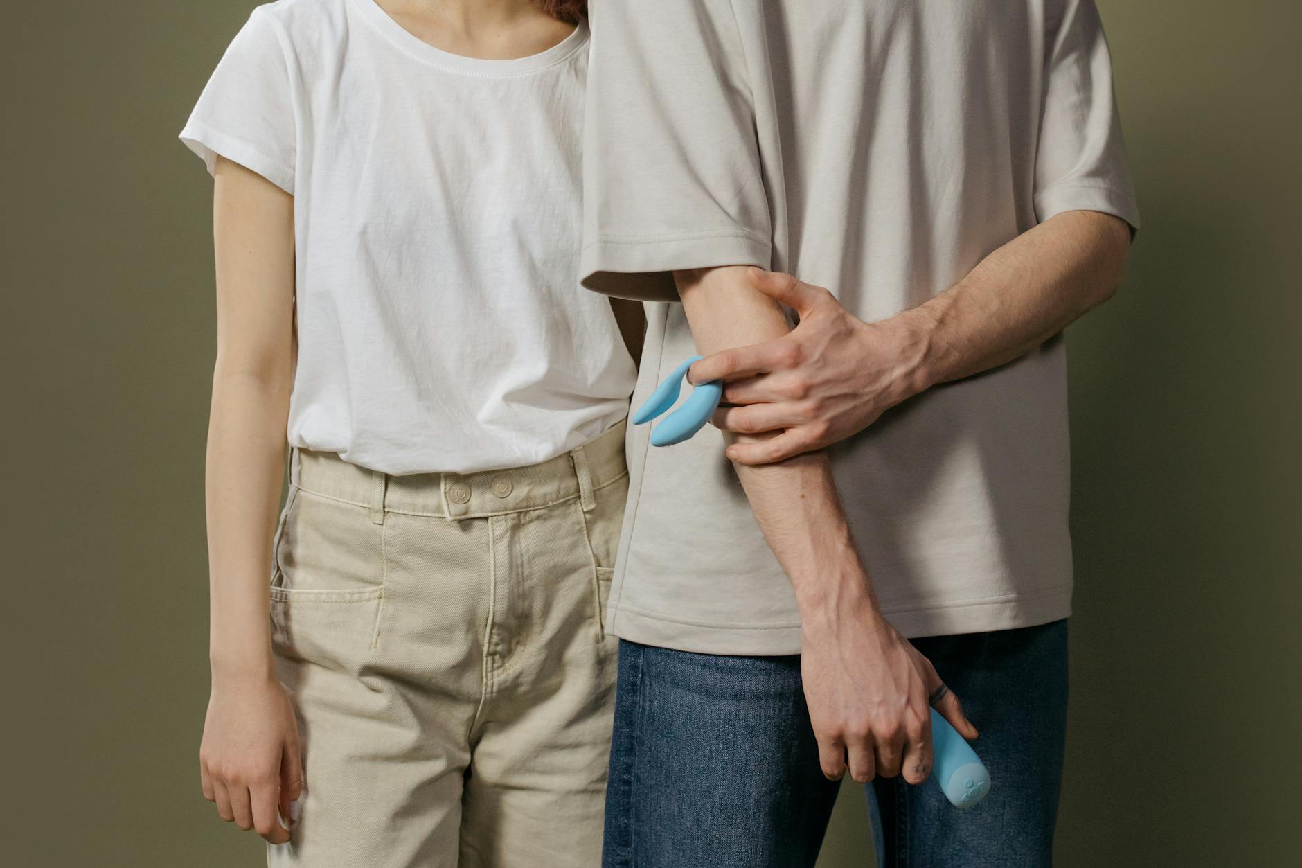A couple standing together indoors, representing modern intimacy and partnership