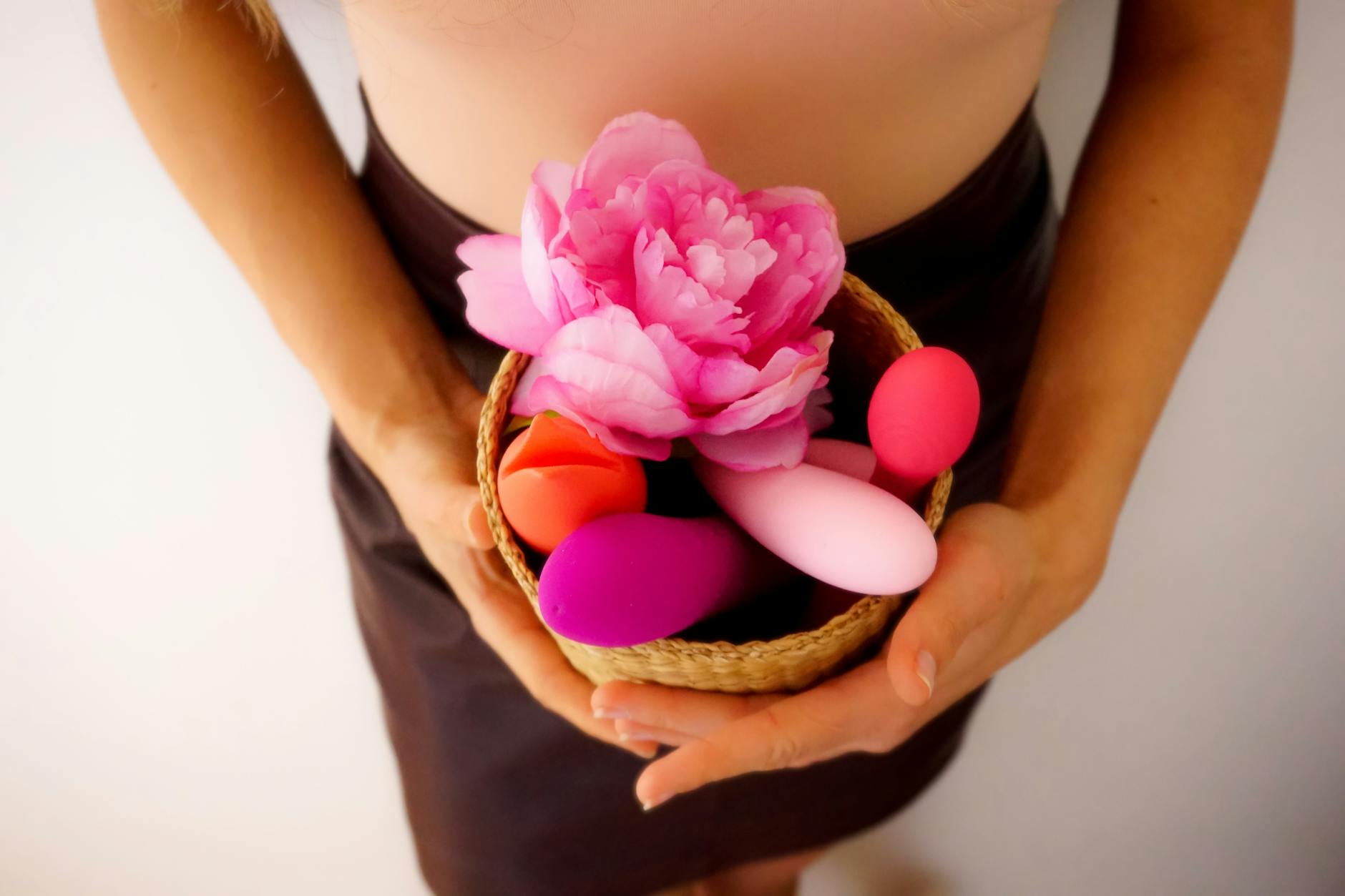 A collection of colorful vibrators displayed with care, representing intentional solo pleasure.